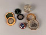 many different types of jewelry on a white surface