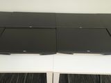 two laptops sitting on top of each other on the desk