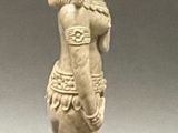statue of a woman with a bird on her head