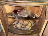 a wooden table with a glass top in the corner of a room