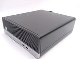 an image of a black computer sitting on top of a white surface