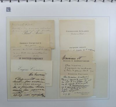 several old papers are hanging on a wall in a room