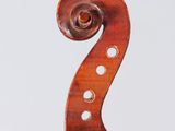 an old violin with a long neck and a curved back