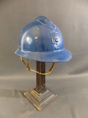 a blue helmet that is on top of a table