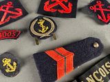 a lot of patches on a table with a name tag