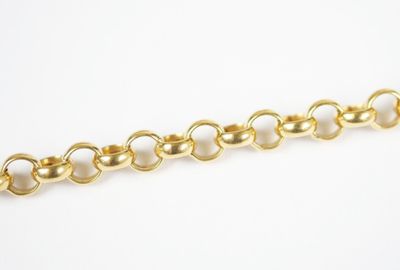 a close up of a gold chain on a white background