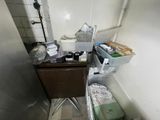 a small bathroom with a sink and a cabinet in it