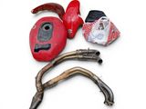 a picture of a motorcycle exhaust pipe and a helmet