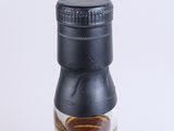 the back of a bottle of whisky on a white surface