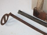 two old tools sitting next to each other on a table