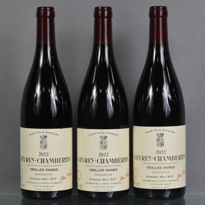 three bottles of wine sitting on a table next to each other