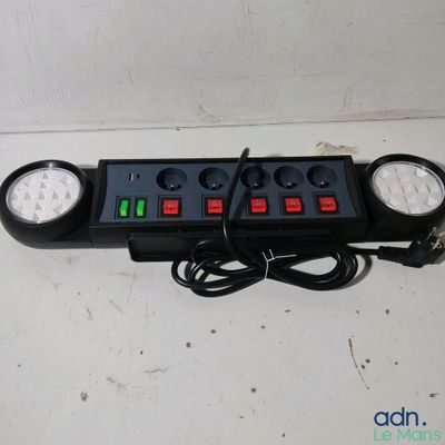 an image of a close up of a power strip on a table