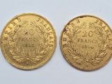 two pieces of gold coins, one of which has a crown and the other of which is a wreath