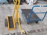 a yellow hand truck with a blue hand truck on it
