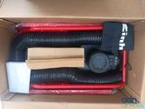 a box with a blower and a hose inside of it