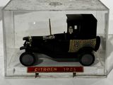 a small model of a car in a clear box
