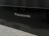 a close up of a panasonic tv sitting on top of a table