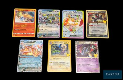 several different pokemon cards sitting on top of a black table