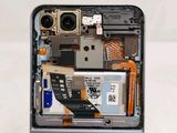 a close up of a cell phone with a broken battery