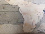 a drawing of a woman in a white dress on a wall