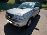 a picture of a silver suv parked in a parking lot