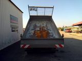 an image of a dump truck parked in a parking lot