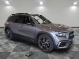 the mercedes gle suv is parked in a large room