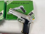 two guns that are sitting next to each other