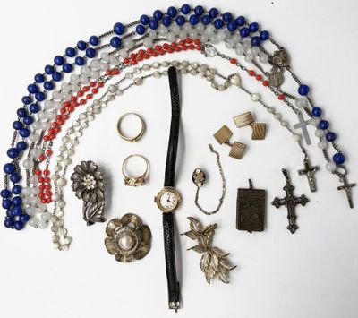 an image of a bunch of beads and rings on a white surface