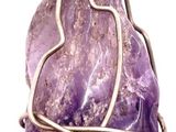 purple amethe stone wrapped in a wire wrapped pendant