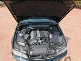 the engine of a car with its hood open and the hood open