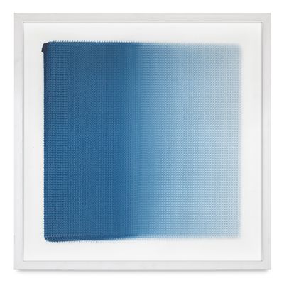 a blue and white painting with a white frame on the wall
