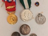 many medals and medals on a white surface