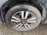 a tire that is sitting on the side of the road