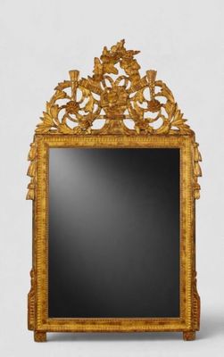 a mirror that is sitting on the floor in front of a wall