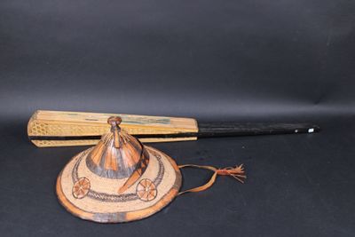 a baseball bat and a hat sitting on a table