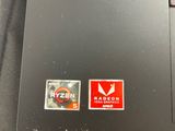 a close up of a laptop with a sticker on it