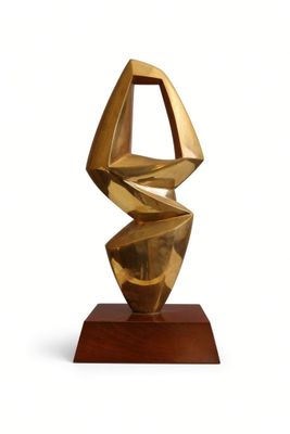 sculpture of a golden sculpture on a wooden base on a white background