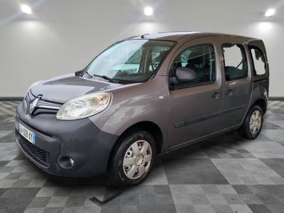 a picture of a small grey van parked in a garage