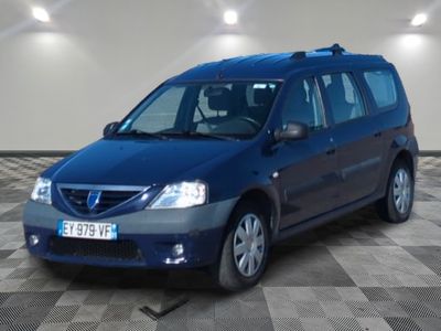a picture of a blue minivan parked in a garage