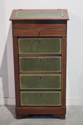 une image représentant une petite commode en bois aux tiroirs verts