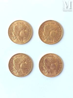 four gold sovereigns of different sizes and shapes on a white surface