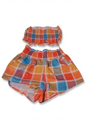 an image of a baby girl ' s plaid shorts and top