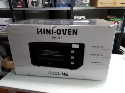 packaging for a mini oven sitting on a table in a store