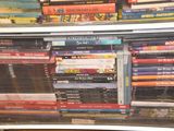 a lot of dvds stacked on top of each other