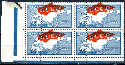 four stamps with the image of a map of the world on them