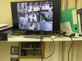 a desk with a monitor and a laptop on it