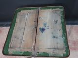 an old wooden table with two open doors on top of it