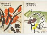two book covers with abstract paintings on them on a white surface
