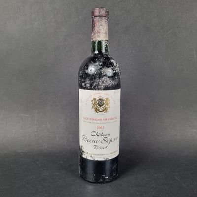 a bottle of wine that is sitting on a table